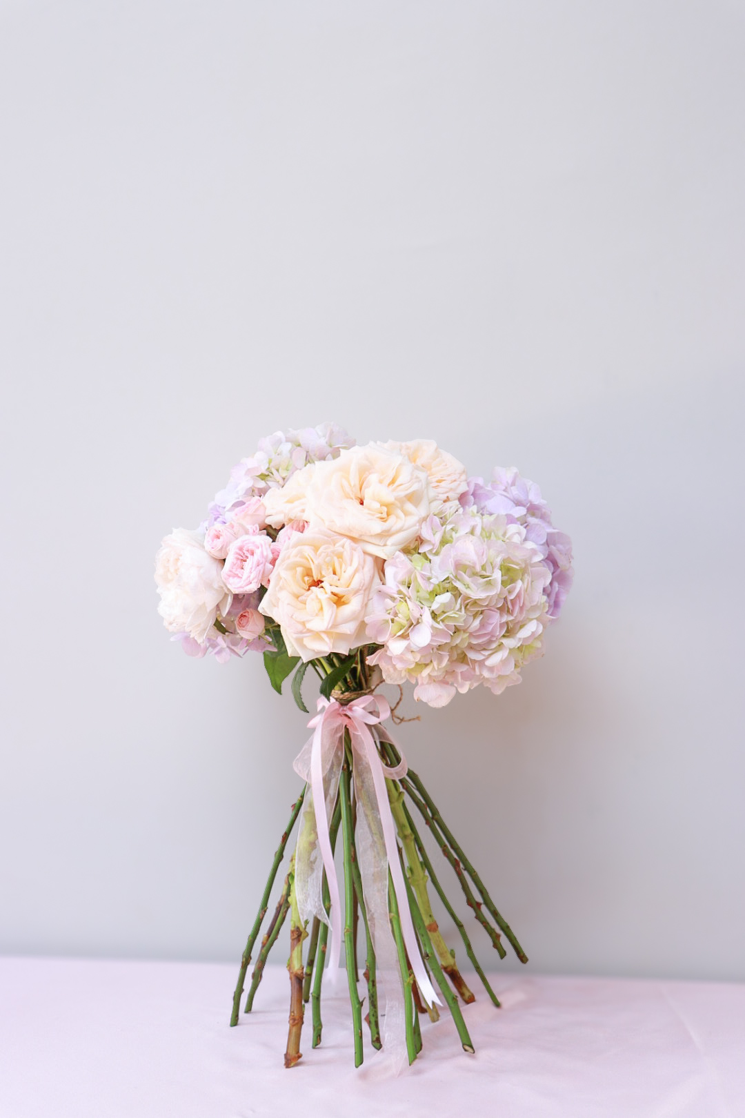 Pink roses and lavender blooms, close detail