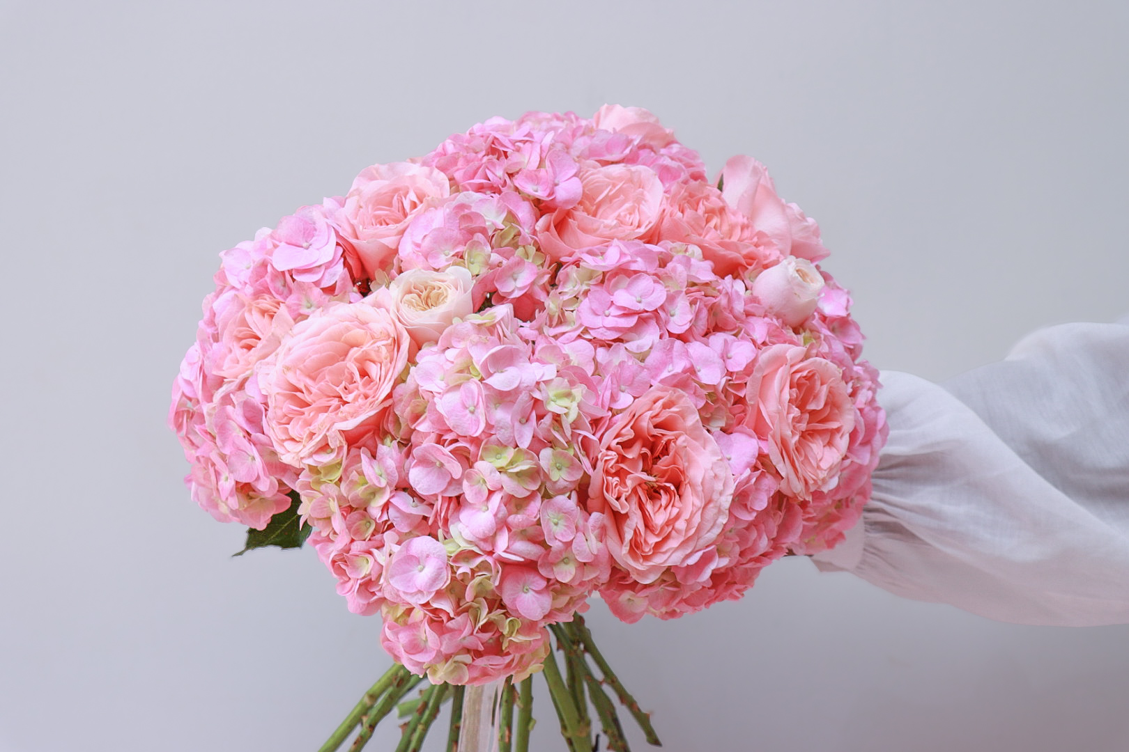 Pink hydrangea and rose hand-tied bouquet